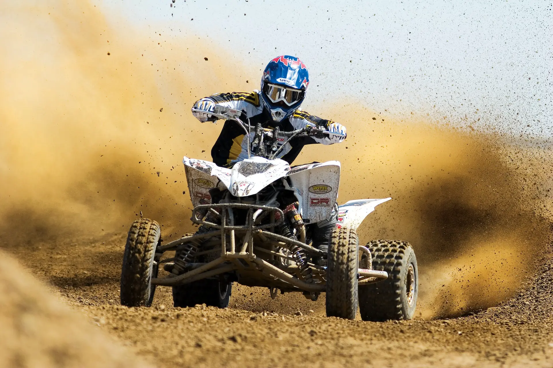 man riding ATV on the dessert